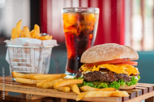 measure fast food, kitchen drinks, Fresh burger and french fries on wooden table