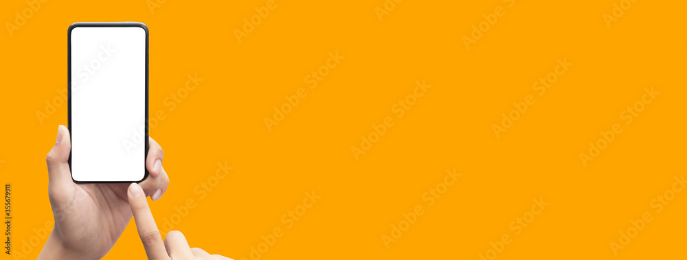 Hand holding the black smartphone and touching blank screen on colorful  orange banner background, Clipping path. Stock Photo | Adobe Stock