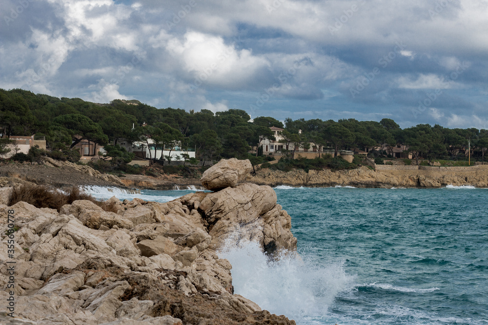Crashing waves over the rocks at the coast of Cala Ratjada, Mallorca, Spain.