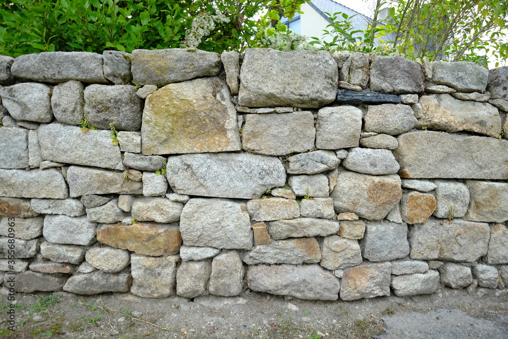 Obraz premium Wall of stones in the west of France. Loire Atlantique departement, april 2020