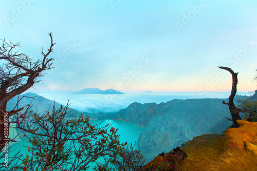 Panoramic view of Kawah Ijen Volcano at Sunrise. The Ijen volcano complex is a group of stratovolcanoes in the Banyuwangi Regency of East Java, Indonesia photo