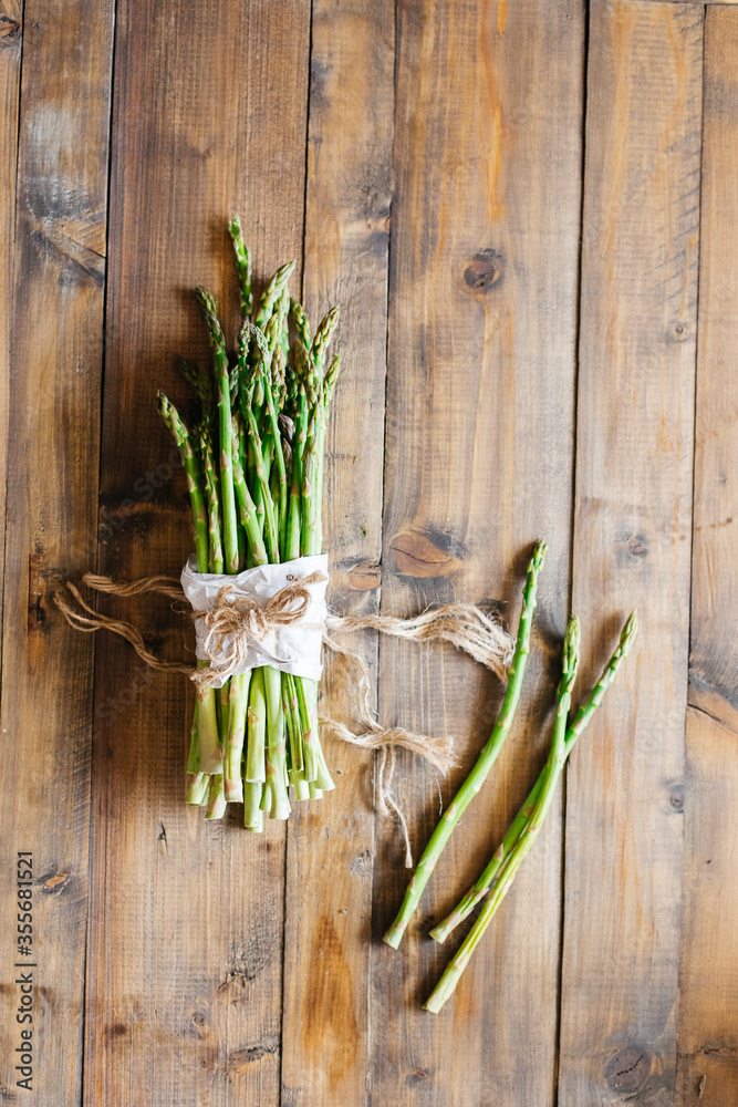 bunch of fresh asparagus on wooden table bunch of fresh asparagus on wooden table