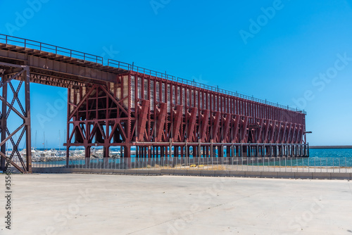 Historical railway used for transport of minerals on cargo ships in Almeria, Spain