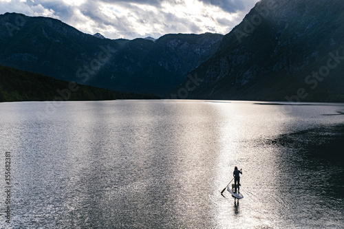 Spring on a mountain lake. SUP