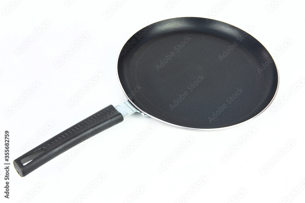 Black frying pan isolated on white background. Black frying pan isolated on white background.