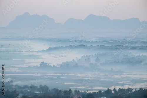 Watercolor view of foggy morning landscape. Hpa An, Myanmar (Burma) © PerfectLazybones