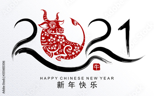 Chinese new year 2021 year of the ox , red paper cut ox character,flower and asian elements with craft style on background.(Chinese translation : Happy chinese new year 2021, year of ox)