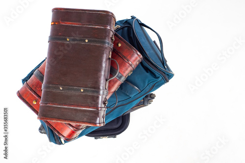 Many bags are in a pile. Su...