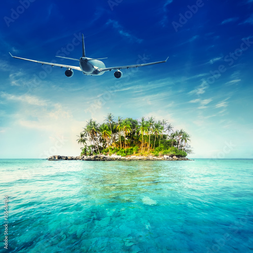 Fototapeta Naklejka Na Ścianę i Meble -  Airplane flying over tropical ocean landscape. Thailand travel