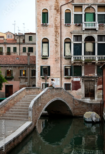 A view of a Venetian canal with traditional townhouses. © Roksana