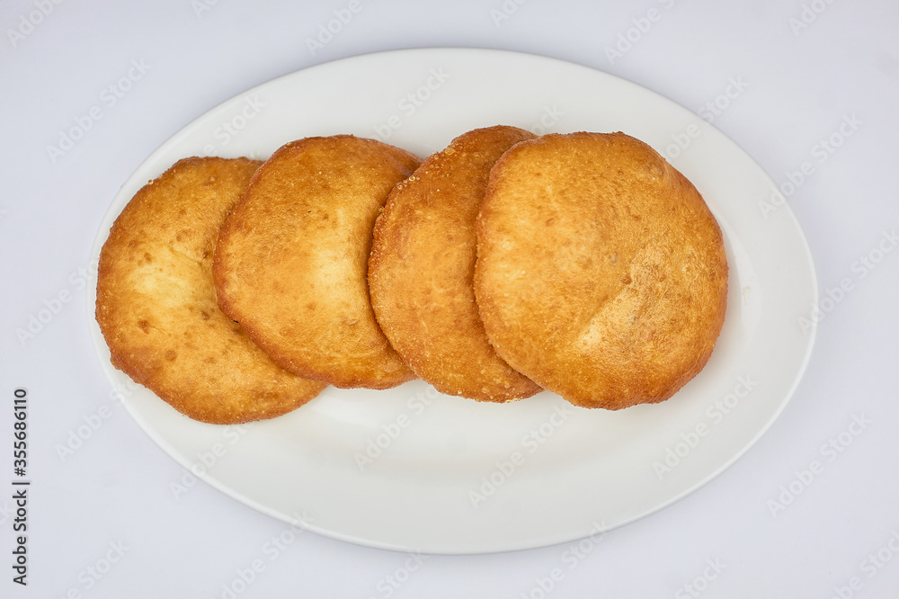 whites with meat on a white plate and white background
