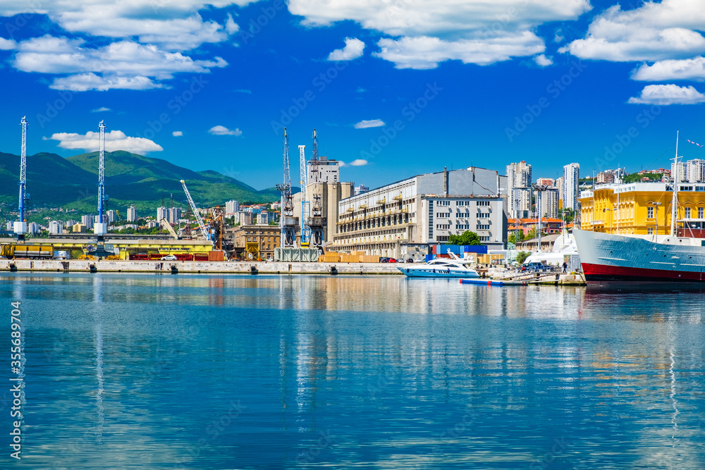 Waterfront view and old cranes in harbor in the city of Rijeka, Croatia. 