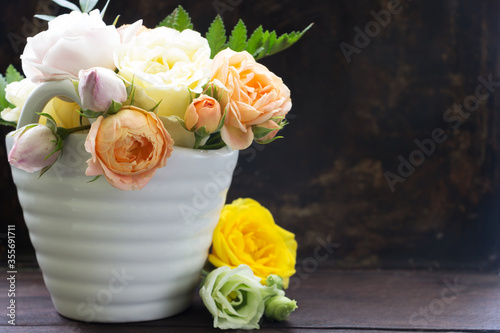 Rose flowers composition.Template design, rustic dark background.  Vintage floral card.