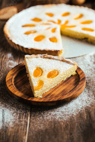 Cut piece of sweet delicious apricot curd cake pie