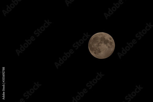 Full moon on black night sky