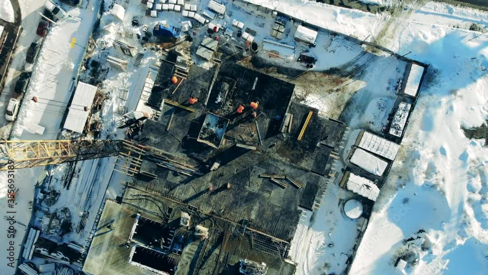 People work on a big construciton site with crane. People work on a big construciton site with crane.