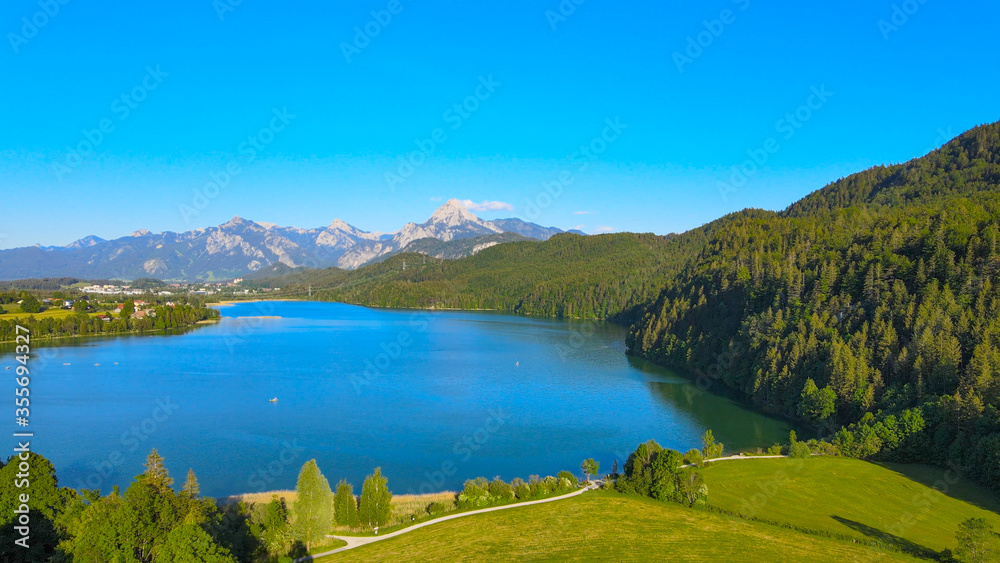 Lake Weissensee in Bavaria - beautiful small lake in the Allgau district - aerial drone footage