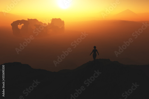 silhouette of a woman on the top of the mountain over a valley with ruins and pyramids