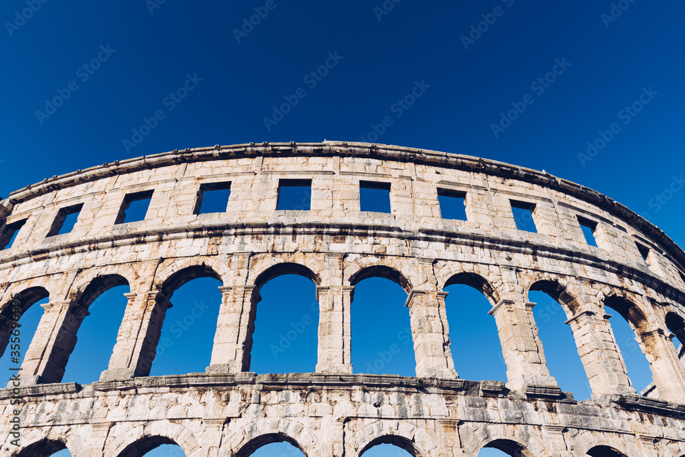 Pula Arena facade with blue sky on the background