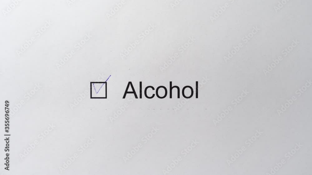 Checkbox Alcohol with a tick. Man hand draws a check mark in the field