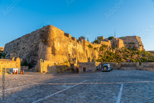 Sunset view of castle of Santa Barbara in Alicante, Spain photo