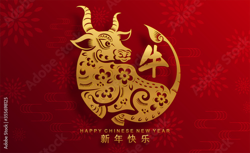 Chinese new year 2021 year of the ox , red paper cut ox character,flower and asian elements with craft style on background.(Chinese translation : Happy chinese new year 2021, year of ox)