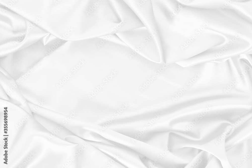White silk wrinkled fabric texture ,clean fabric textures are perfect background for your creative with copy space for design in center White silk wrinkled fabric texture ,clean fabric textures are perfect background for your creative with copy space for design in center