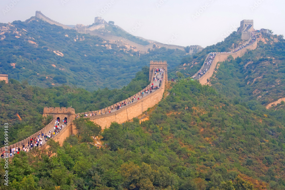 a queue of tourists on the great chinese wall