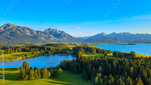Fototapeta Naklejka Na Ścianę i Meble -  Aerial view over Lake Forggensee at the city of Fuessen in Bavaria Germany