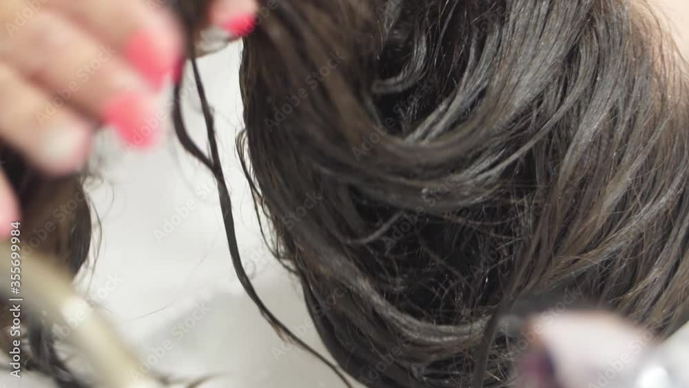 Hairdresser washing client hair slow motion Hairdresser washing client hair slow motion