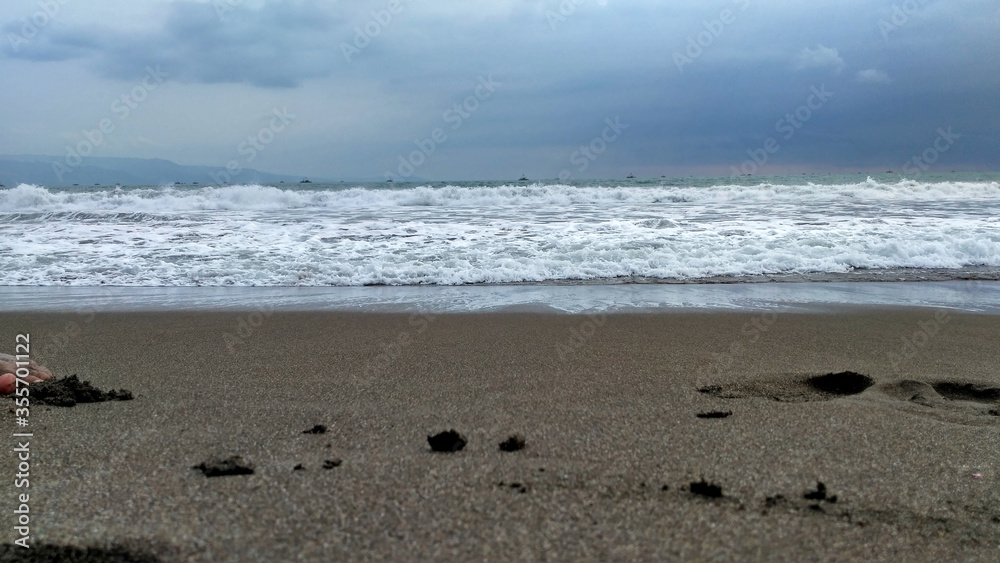 A morning snapshot of the waves on the beach A morning snapshot of the waves on the beach