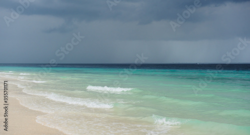 Cloudy landscape of Indian ocean sandy beach before the storm.ZANZIBAR - TANZANIA