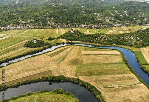 Aerial view of river Lika meandering through Donji Kosinj and Lipovo Polje villages in Croatia.