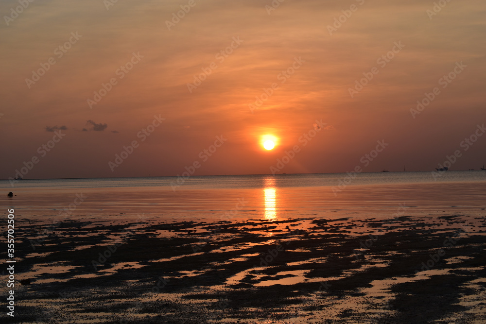 Fototapeta premium Beautiful Sunset landscape at Tanjung Pendam Beach, Bangka Belitung island, Indonesia