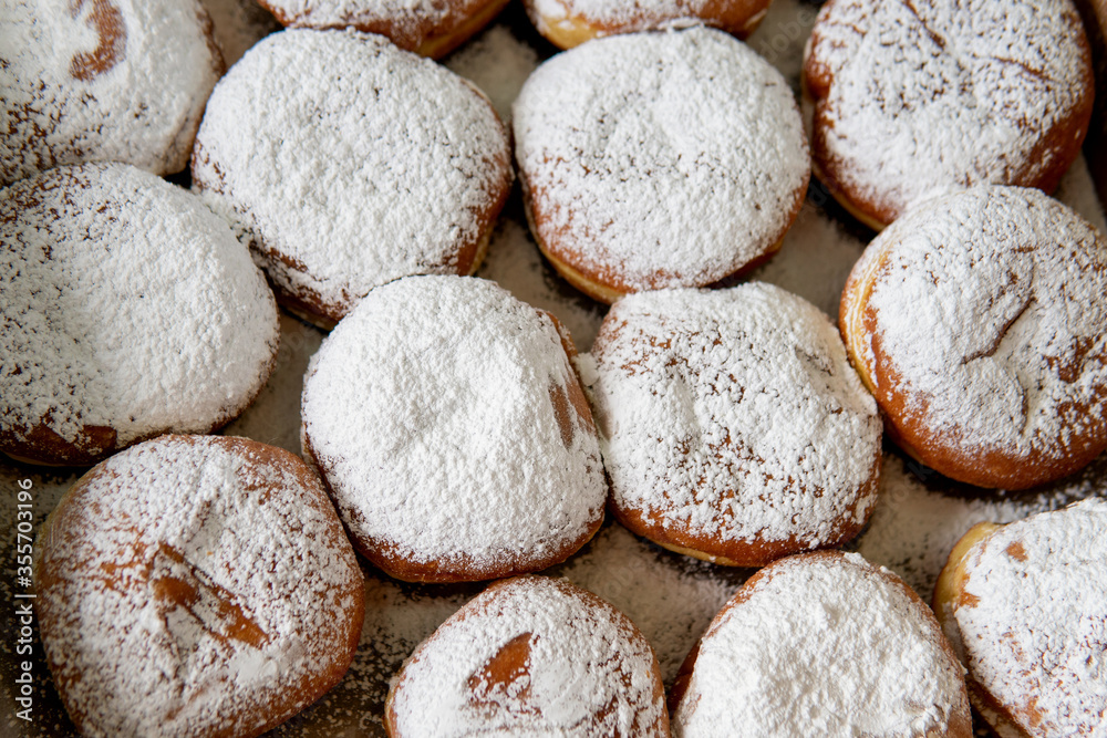 Fresh Tasty Hanukkah Donuts sold in the market in Haifa, Israel. View from above Fresh Tasty Hanukkah Donuts sold in the market in Haifa, Israel. View from above