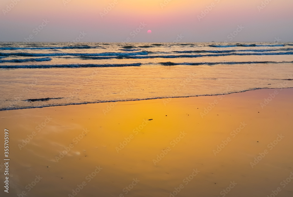 Ocean waves hitting the beach of Cox's Bazar in Bangladesh in the evening. The longest beach