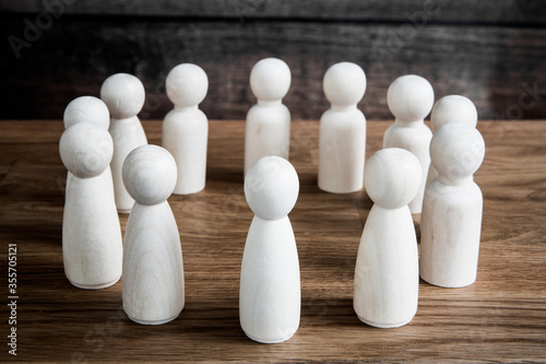 A business or social meeting concept with a crowd of generic figures forming a circle during a forum  meeting or convention conference