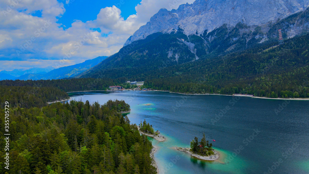Fototapeta premium Wonderful Eibsee in Bavaria at the German Alps from above - aerial view