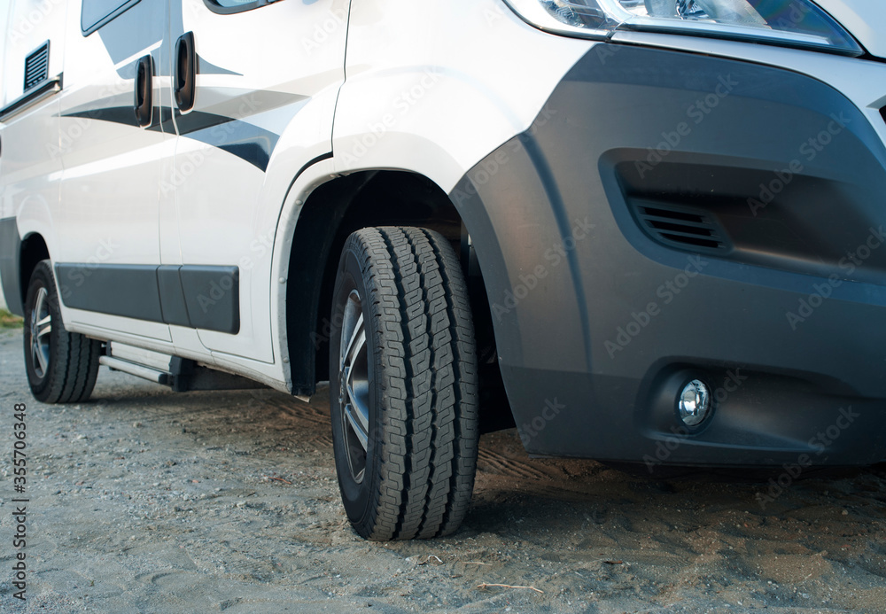 detail of camper van on sand