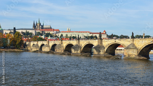 Charles Bridge is famous historic bridge that crosses Vltava river. Its construction started in 1357 under auspices of King Charles IV