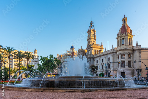 Town hall behind a fountain in Spanish town Valencia photo