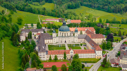 Ettal Abbey, called Kloster Ettal, a monastery in the village of Ettal, Bavaria, Germany - aerial photography