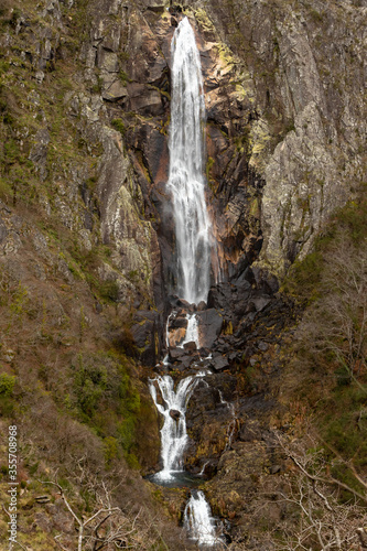 Queda de água em Portugal , inserida na serra da Freita , com mais de 75 metros de altura total , em Arouca , Portugal photo