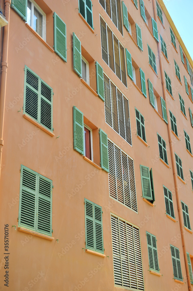 Colorful buildings with shutters in the streets  in Italy