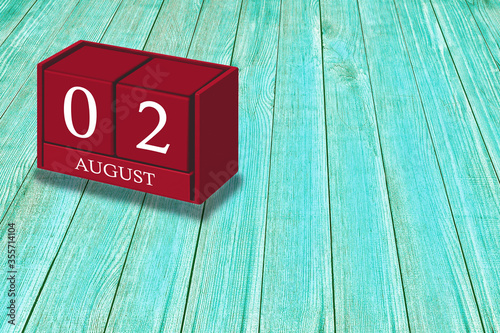 August 2nd, Day 02 of August month, Red calendar on workplace green wood, Empty space for text, Copy space right, 3D illustration