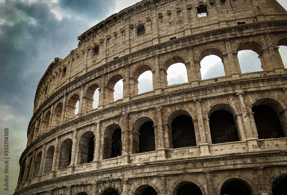 historical roman empire colosseum with blue sky dramatic rome