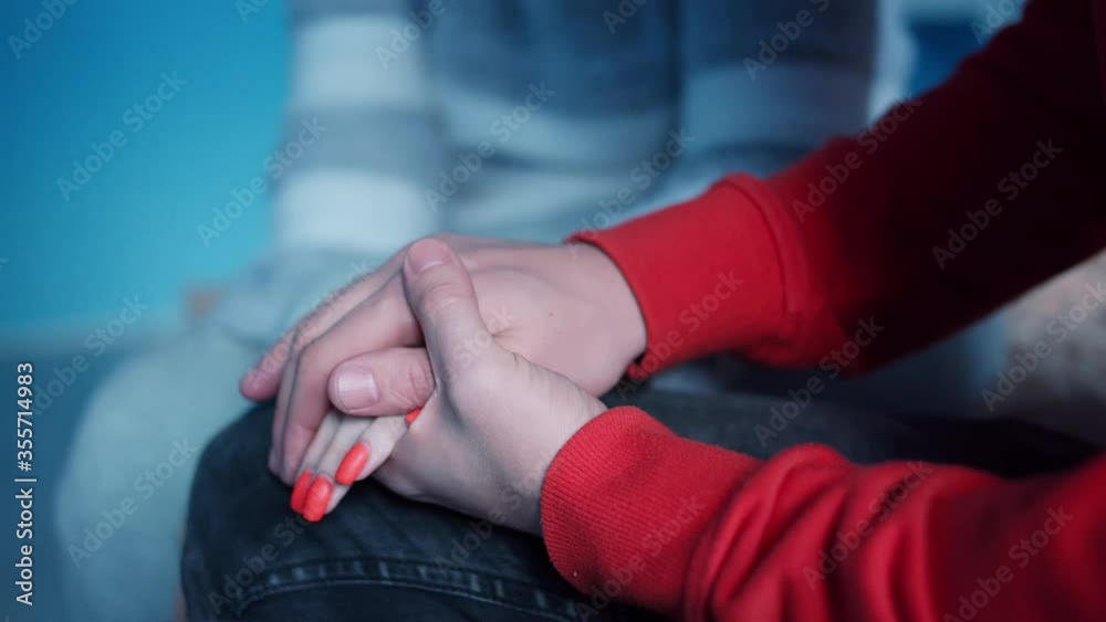 Man holds the palm of a woman in his, support and care concept, close up Man holds the palm of a woman in his, support and care concept, close up