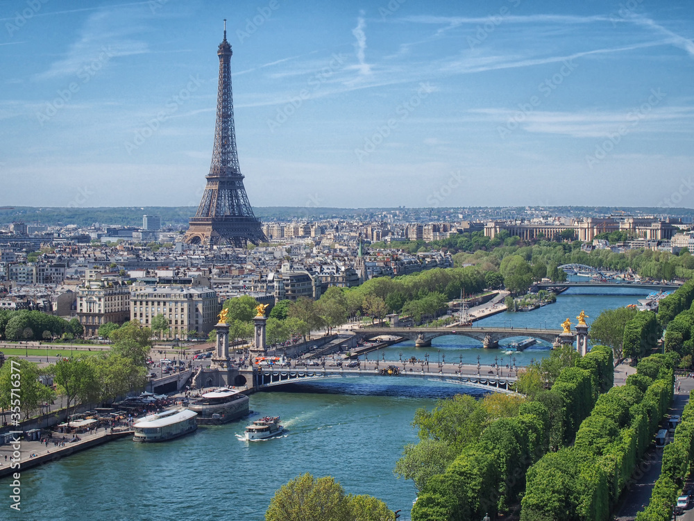 View from above on the Seine river (Paris) with the Eiffel tower on the horizon