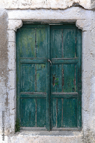 Beautiful  Wooden Door Of A Typical House In Pyrgos Kallistis On The Island Of Santorini. © mstudio