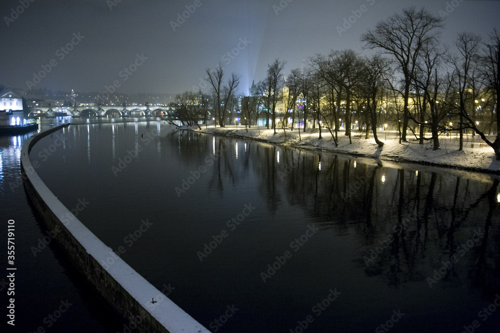 Prague, Czech Republic, river Vltava at night, view from bridge Most Legii of Charles Bridge and island Strelecky ostrov